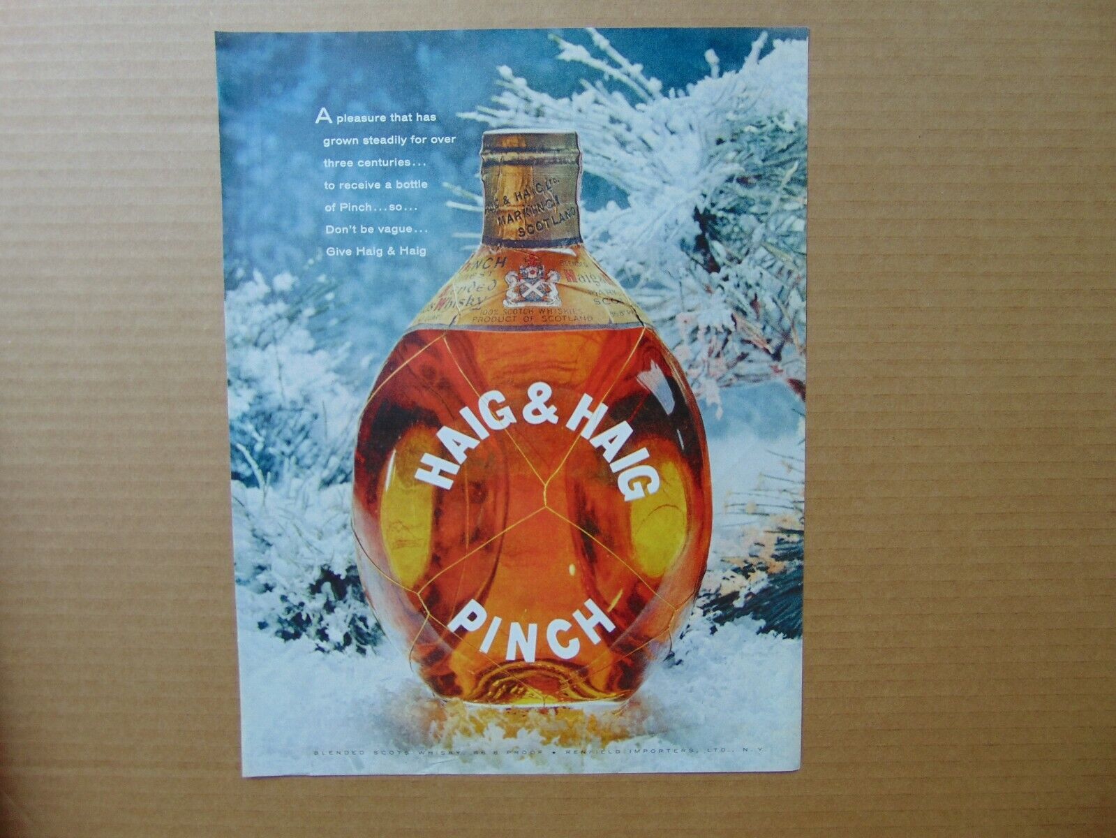 1957 Haig & Haig Pinch Scotch Whiskey Bottle Set In Winter Scene Art Print Ad